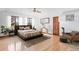 Bright main bedroom with hardwood floors, ceiling fan and neutral decor at 6231 Prospect Rd, Longmont, CO 80503
