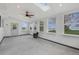 Sun room with a skylight, many windows, a ceiling fan and access to a backyard at 6231 Prospect Rd, Longmont, CO 80503