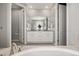 Bright, clean bathroom featuring dual vanity sinks and access to a private shower and toilet room at 27375 E Alder Dr, Aurora, CO 80016