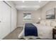 A bedroom with a cozy bed, a closet, and a window providing natural light at 27375 E Alder Dr, Aurora, CO 80016