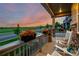 Charming front porch with rocking chairs and flower boxes, offering a relaxing outdoor space to enjoy the neighborhood views at 27375 E Alder Dr, Aurora, CO 80016