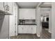 View of the mud room showing cabinets and door to the exterior at 27375 E Alder Dr, Aurora, CO 80016