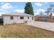 Backyard with patio and small lawn, ideal for outdoor seating and entertainment at 1665 Yukon St, Lakewood, CO 80214