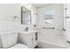 Clean, bright bathroom with a modern vanity, tiled shower, and new fixtures at 1665 Yukon St, Lakewood, CO 80214