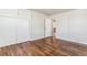 Bright bedroom features hardwood floors, fresh paint, and spacious closet at 1665 Yukon St, Lakewood, CO 80214