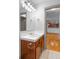 Bathroom with hardwood floors, white countertop and view of open kitchen at 3211 Zuni St # 14, Denver, CO 80211