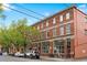 Attractive three-story brick building with large windows and street parking available at 3211 Zuni St # 14, Denver, CO 80211