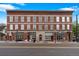 Stately red brick building with large windows, street parking, and historic charm at 3211 Zuni St # 14, Denver, CO 80211