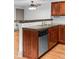 Kitchen features stainless appliances, wooden cabinets, and concrete countertop at 3211 Zuni St # 14, Denver, CO 80211