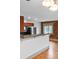 The kitchen features stainless steel appliances, breakfast bar, and exposed brick at 3211 Zuni St # 14, Denver, CO 80211