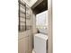 Laundry closet with stackable washer and dryer and wire shelving for storage at 3211 Zuni St # 14, Denver, CO 80211