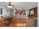 Inviting living room boasts hardwood floors, brick accent wall, and open layout at 3211 Zuni St # 14, Denver, CO 80211