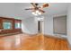 Living room featuring hardwood floors and exposed brick wall at 3211 Zuni St # 14, Denver, CO 80211