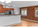 Living room featuring stainless appliances and exposed brick at 3211 Zuni St # 14, Denver, CO 80211