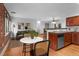 Charming living area features hardwood floors, brick wall, and modern kitchen at 3211 Zuni St # 14, Denver, CO 80211