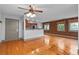 Open concept living area features hardwood floors and breakfast bar at 3211 Zuni St # 14, Denver, CO 80211