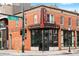 Corner view of Kumoya Japanese Kitchen, featuring brick facade, large signage, and street intersection at 3211 Zuni St # 14, Denver, CO 80211