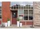 Inviting brick building with large windows and Duo Restaurant sign, enhanced by potted greenery at 3211 Zuni St # 14, Denver, CO 80211