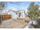 White two story home with an outdoor living space and privacy fence at 16820 Bitterbrush, Parker, CO 80134