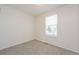 This bedroom features neutral carpet, a window for natural light, and is newly painted at 16820 Bitterbrush, Parker, CO 80134