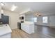 Modern kitchen with white cabinets, stainless steel appliances, and an open layout at 16820 Bitterbrush, Parker, CO 80134