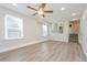 Bright living room with vinyl floors, neutral paint, and a ceiling fan at 16820 Bitterbrush, Parker, CO 80134