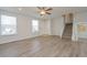 Inviting living room with vinyl floors, stairs, and two large windows at 16820 Bitterbrush, Parker, CO 80134