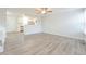 Open-concept living room with wood flooring and access to the kitchen at 16820 Bitterbrush, Parker, CO 80134