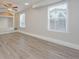 Bright living room with vinyl floors, neutral paint, and a ceiling fan at 16820 Bitterbrush, Parker, CO 80134