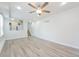 Open-concept living room with a ceiling fan and access to the stairs at 16820 Bitterbrush, Parker, CO 80134