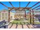 Backyard oasis featuring a pergola, fire pit, and artificial turf at 7888 Tejon St, Denver, CO 80221