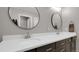Bathroom with double sinks, modern lighting, and vanity at 7888 Tejon St, Denver, CO 80221