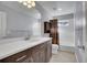 Clean bathroom, featuring a shower/tub combo, vanity with dark brown cabinets, and white countertop at 7888 Tejon St, Denver, CO 80221