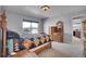 Comfortable bedroom with a wooden bed frame, dresser, and window with natural light at 7888 Tejon St, Denver, CO 80221