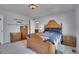 Bedroom featuring a bed with decorative wood frame and a bathroom ensuite at 7888 Tejon St, Denver, CO 80221