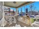 Front porch with seating area, and hanging wind chimes at 7888 Tejon St, Denver, CO 80221