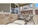 Covered front porch featuring seating area with comfortable chairs and decorative flowers at 7888 Tejon St, Denver, CO 80221