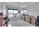 Home office with wood desks and cabinets, carpeted floor, and window with natural light at 7888 Tejon St, Denver, CO 80221