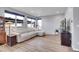 Comfortable living room with a large sectional sofa, lots of windows, hardwood floors, and contemporary decor at 7888 Tejon St, Denver, CO 80221
