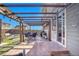 Covered patio with seating area and access to the backyard at 7888 Tejon St, Denver, CO 80221