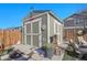 A storage shed with double doors and a small window, providing ample space for outdoor equipment at 7888 Tejon St, Denver, CO 80221