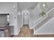 Stairwell with white railings and a hanging plant at 7888 Tejon St, Denver, CO 80221