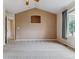 Spacious bedroom with large window, plush carpeting, and a calming neutral color palette at 1185 S Kramer Ct, Aurora, CO 80012