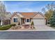Charming brick home featuring a well-manicured front yard and two-car garage at 1185 S Kramer Ct, Aurora, CO 80012