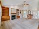 Bright living room with high ceilings, built-in shelves, and a cozy fireplace at 1185 S Kramer Ct, Aurora, CO 80012