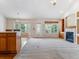 Spacious living room with a cozy fireplace, natural light, and open floor plan at 1185 S Kramer Ct, Aurora, CO 80012