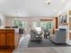 Comfortable living room featuring an open layout with a fireplace and dining area at 1185 S Kramer Ct, Aurora, CO 80012