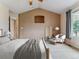 Relaxing main bedroom featuring high ceilings, a large window, and a calming color palette at 1185 S Kramer Ct, Aurora, CO 80012