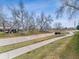 Picturesque neighborhood with walking paths and mature trees creating a serene environment at 1185 S Kramer Ct, Aurora, CO 80012