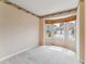 Inviting office space with large bay window and neutral carpet at 1185 S Kramer Ct, Aurora, CO 80012